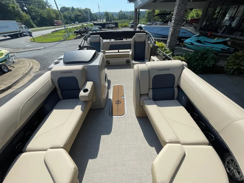 Slide: The Image of 2026 Harris Solstice 230 pontoon boat interior with beige seating and modern design. - 16