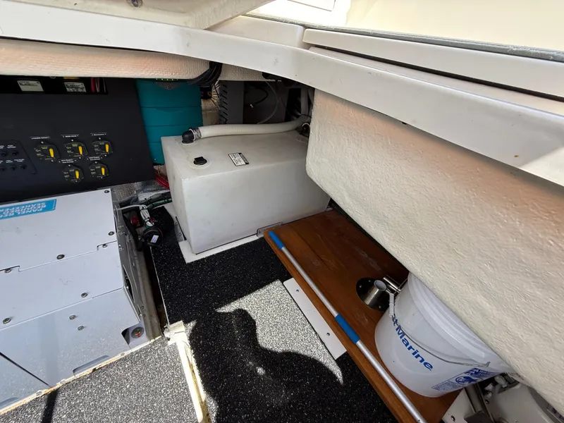 Slide: The Image of Engine compartment of 2022 Regal 36 XO boat with equipment and storage. - 11