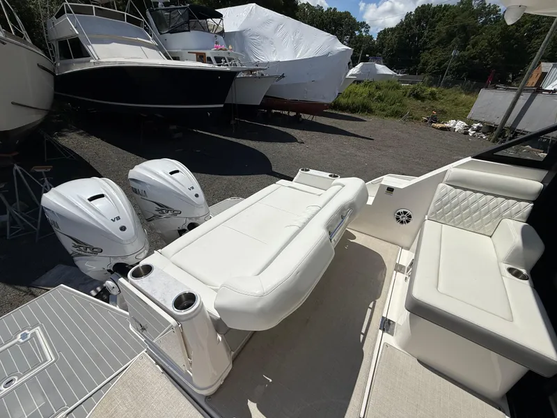 Slide: The Image of 2022 Regal 36 XO boat with twin Yamaha V8 engines, featuring luxurious seating. - 20