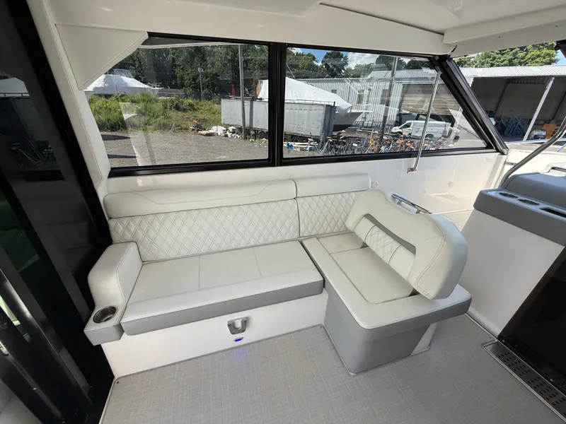 Slide: The Image of Interior of 2022 Regal 36 XO yacht with white leather seating. - 24