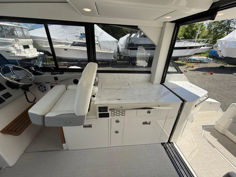 Slide: The Image of Interior of 2022 Regal 36 XO yacht with helm and seating area. - 26