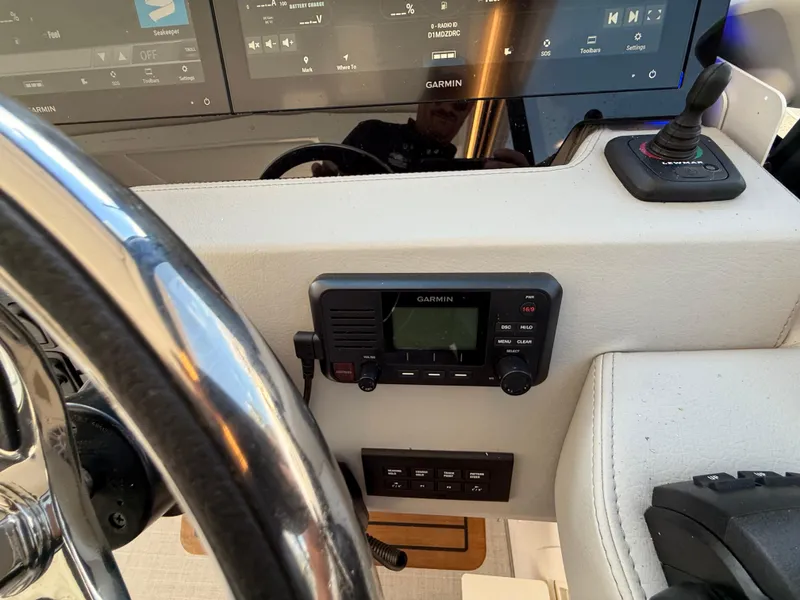 Slide: The Image of 2022 Regal 36 XO helm with Garmin navigation and control systems. - 34