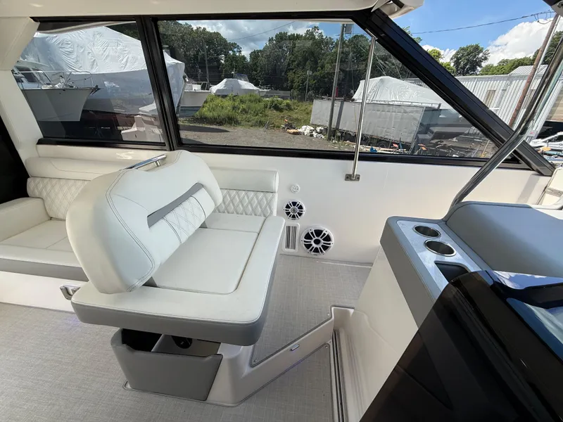 Slide: The Image of 2022 Regal 36 XO boat interior with white seating and modern design. - 39