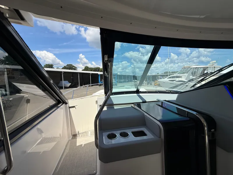 Slide: The Image of Interior view of 2022 Regal 36 XO yacht cockpit with clear windows and modern design. - 40
