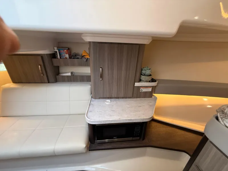 Slide: The Image of Interior of 2022 Regal 36 XO yacht with modern cabinetry and seating. - 49