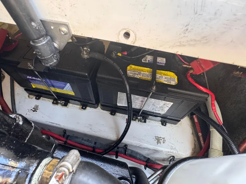 Slide: The Image of Batteries and wiring inside a 2007 Sea Ray 220 Sundeck boat. - 14
