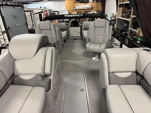 Slide: The Image of 2025 Regency 230 DL3 pontoon boat interior with luxurious seating and modern design. - 16