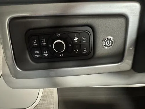 Slide: The Image of Control panel of 2025 Regency 230 DL3 boat with various function buttons. - 8