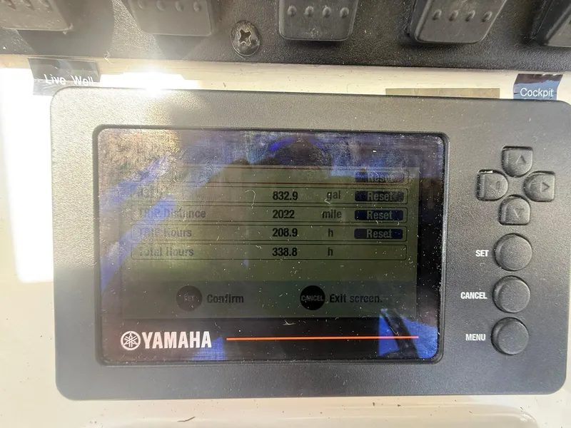 Slide: The Image of Yamaha display on 2017 Sea Hunt Ultra 234 showing fuel and engine hours. - 13