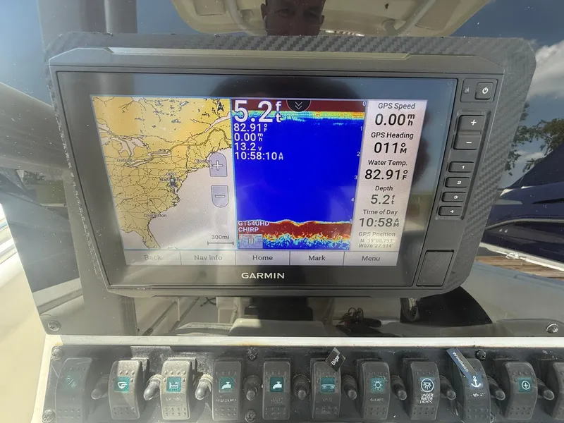 Slide: The Image of Garmin GPS display on 2017 Sea Hunt Ultra 234 boat, showing navigation and depth data. - 15