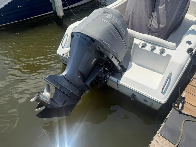 Slide: The Image of 2017 Sea Hunt Ultra 234 boat with Yamaha outboard motor at dock. - 23