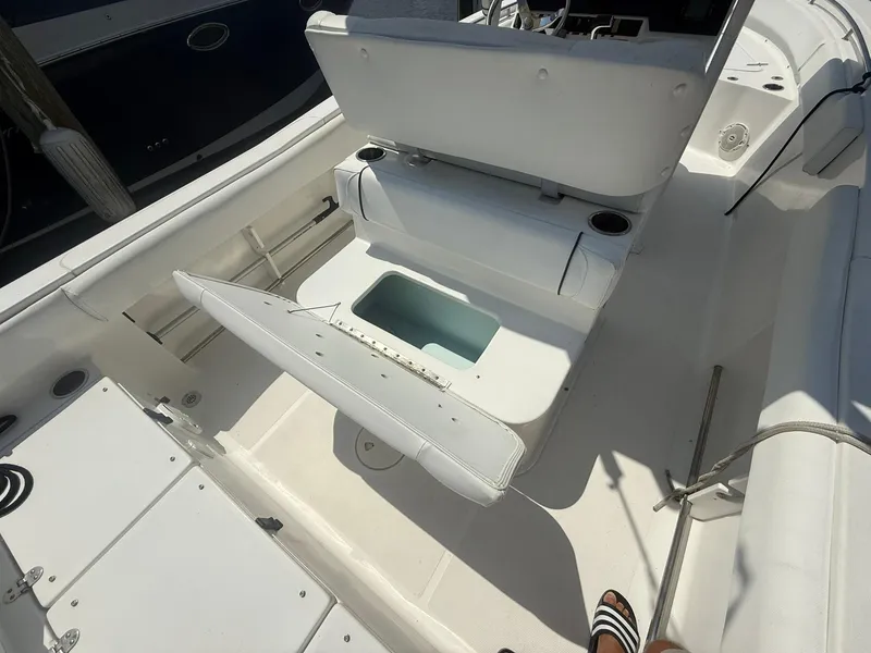 Slide: The Image of 2017 Sea Hunt Ultra 234 boat interior with open storage compartment. - 9