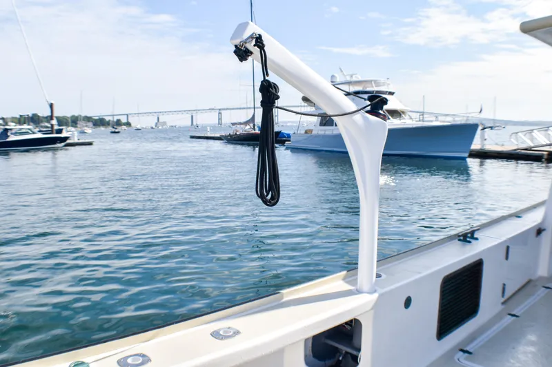 Slide: The Image of 2021 Mussel Ridge Downeast boat docked in a marina with scenic water view. - 24