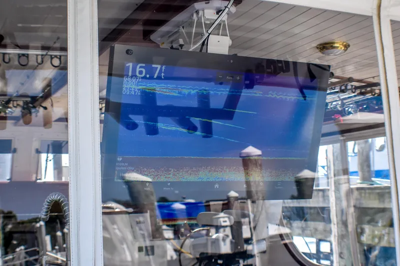 Slide: The Image of Fishfinder display on 2021 Mussel Ridge downeast boat, showing depth and sonar readings. - 27