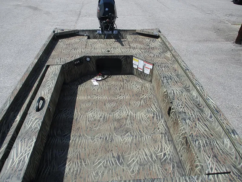 Slide: The Image of 2026 Tracker Grizzly 1654 T Sportsman boat with camouflage interior design. - 12