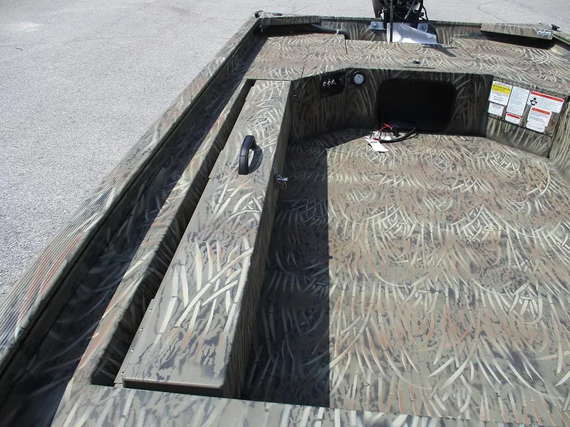 Slide: The Image of 2026 Tracker Grizzly 1654 T Sportsman boat interior with camouflage design. - 13
