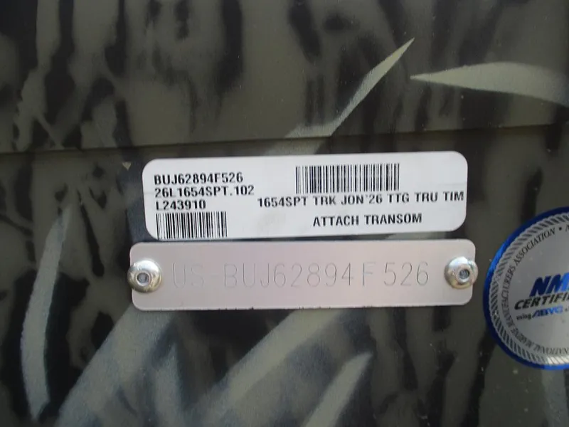 Slide: The Image of Serial number and certification label on 2026 Tracker Grizzly 1654 T Sportsman boat. - 23