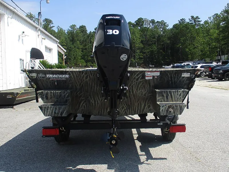 Slide: The Image of 2026 Tracker Grizzly 1654 T Sportsman boat with camo design and 30 HP motor. - 8