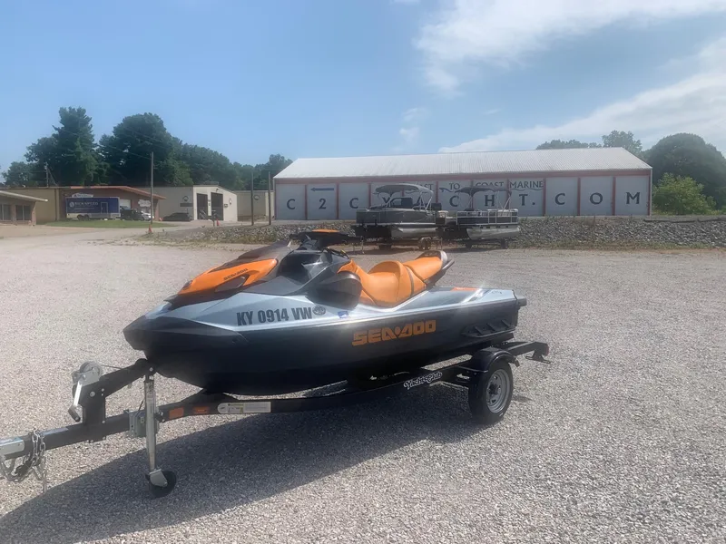Slide: The Image of 2020 Sea-Doo GTI SE 170 jet ski on trailer in a gravel lot. - 3