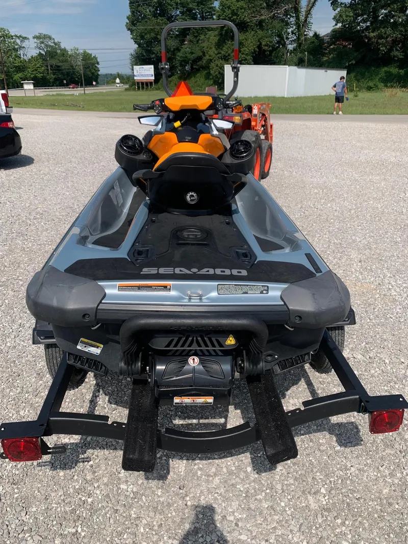 Slide: The Image of 2020 Sea-Doo GTI SE 170 on trailer, parked on gravel, with trees in background. - 4