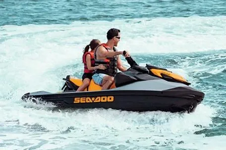 Slide: The Image of Manufacturer Provided Image: 2020 Sea-Doo GTI SE 170 jet ski on water with two riders. - 9