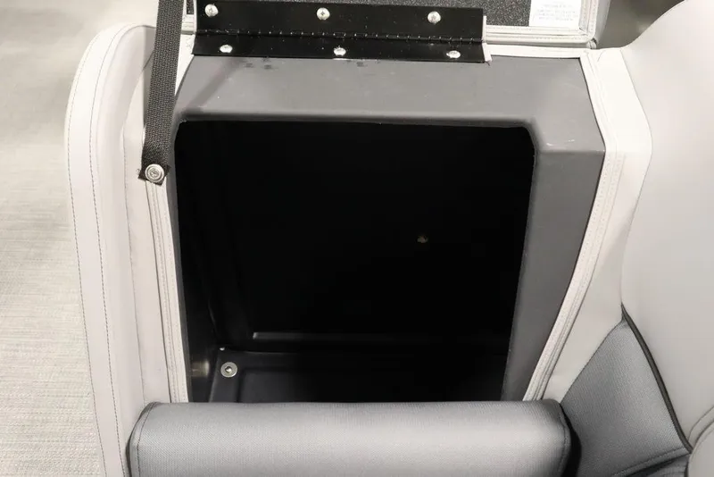 Slide: The Image of 2025 Bentley Pontoons 243 Navigator Tri-toon storage compartment with open lid, showcasing interior space. - 12