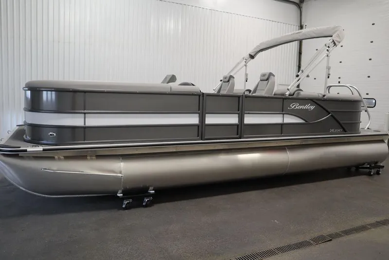 Slide: The Image of 2025 Bentley Pontoons 243 Navigator Tri-toon in a showroom, featuring sleek design and modern amenities. - 14