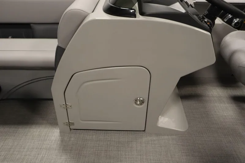 Slide: The Image of 2025 Bentley Pontoons 243 Navigator Tri-toon helm station with storage compartment. - 20