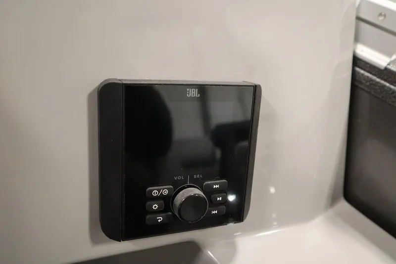 Slide: The Image of JBL audio control panel on 2025 Bentley Pontoons 243 Navigator Tri-toon. - 25