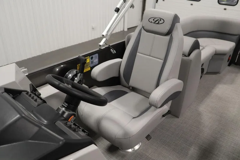 Slide: The Image of 2025 Bentley Pontoons 243 Navigator Tri-toon captain's chair and steering console. - 27