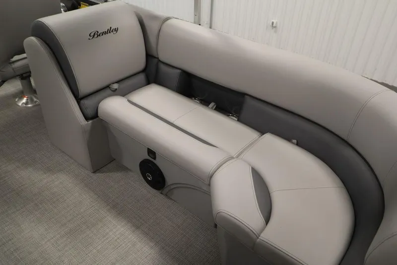 Slide: The Image of 2025 Bentley Pontoons 243 Navigator Tri-toon interior seating, featuring luxurious gray upholstery. - 28