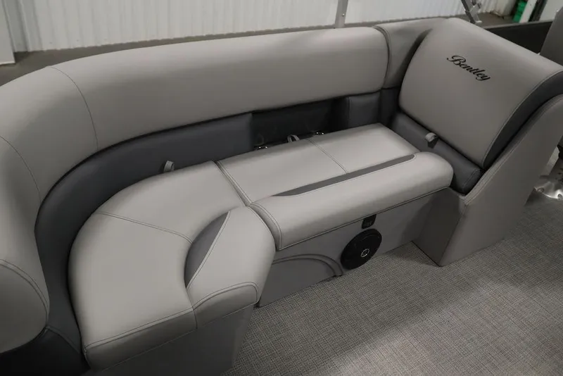Slide: The Image of 2025 Bentley Pontoons 243 Navigator Tri-toon interior seating, featuring luxurious gray upholstery. - 29