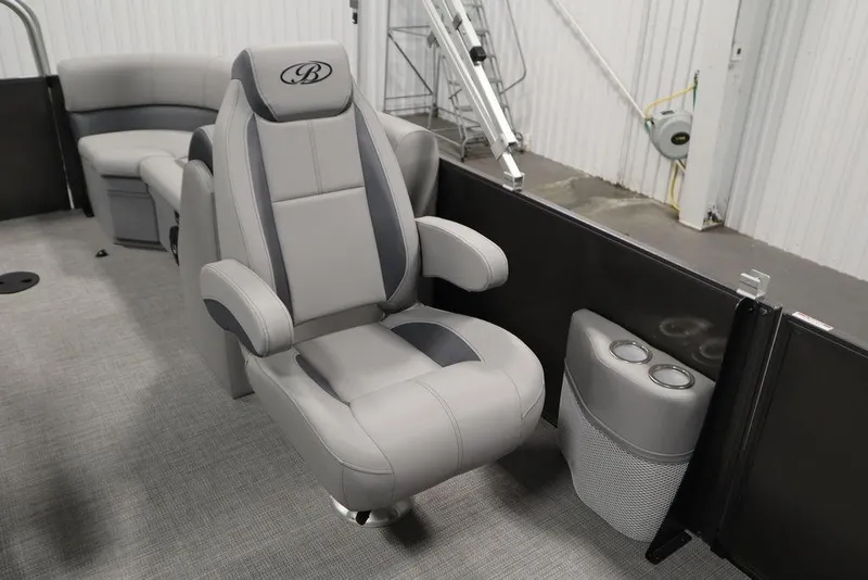 Slide: The Image of 2025 Bentley Pontoons 243 Navigator Tri-toon interior with luxurious seating and cup holders. - 34