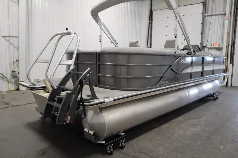 Slide: The Image of 2025 Bentley Pontoons 243 Navigator Tri-toon in a showroom, showcasing sleek design and modern features. - 4