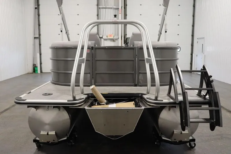 Slide: The Image of 2025 Bentley Pontoons 243 Navigator Tri-toon in a showroom, rear view. - 6