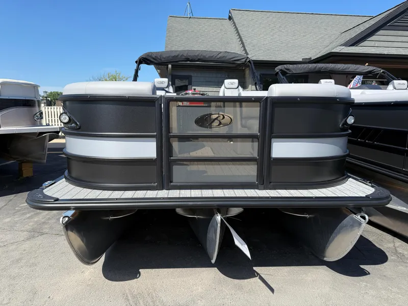 Slide: The Image of 2026 Bentley Pontoons Legacy 223 Navigator, sleek black and gray design, docked outdoors. - 1