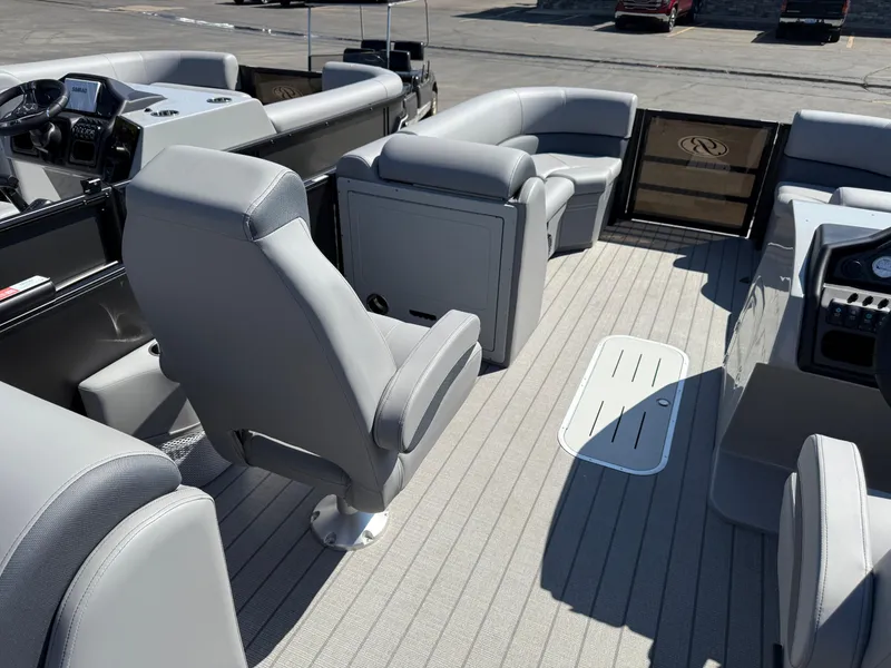 Slide: The Image of Interior of 2026 Bentley Pontoons Legacy 223 Navigator with gray seating and modern dashboard. - 11