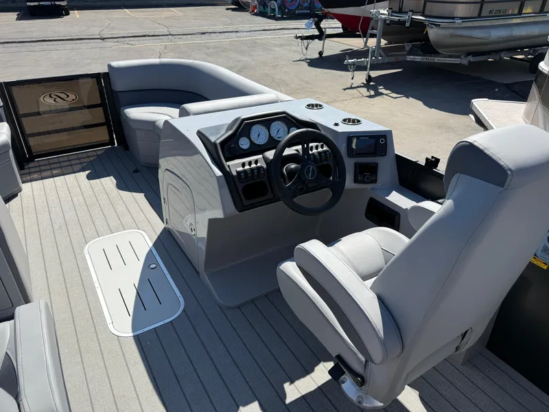 Slide: The Image of 2026 Bentley Pontoons Legacy 223 Navigator interior with steering console and seating. - 12