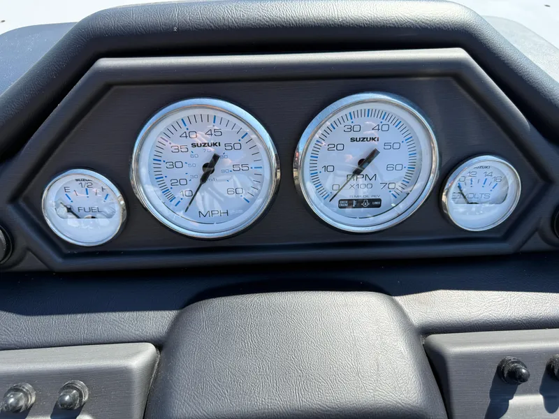 Slide: The Image of Dashboard of 2026 Bentley Pontoons Legacy 223 Navigator with Suzuki gauges. - 19