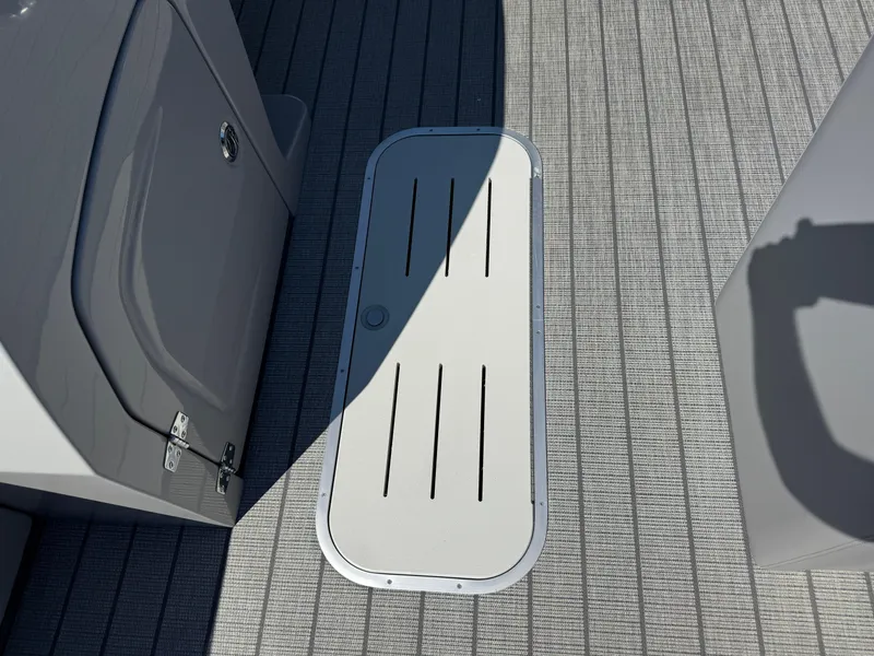 Slide: The Image of Deck of 2026 Bentley Pontoons Legacy 223 Navigator with storage hatch. - 23