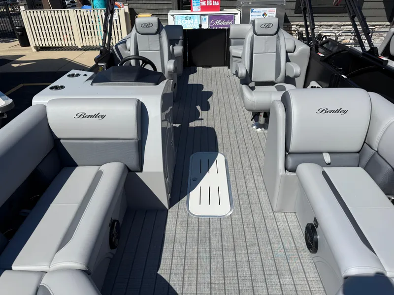 Slide: The Image of 2026 Bentley Pontoons Legacy 223 Navigator interior with luxurious gray seating and modern design. - 26