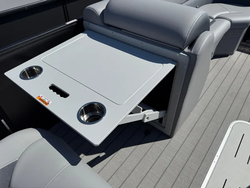 Slide: The Image of 2026 Bentley Pontoons Legacy 223 Navigator interior with foldable table and cup holders. - 30