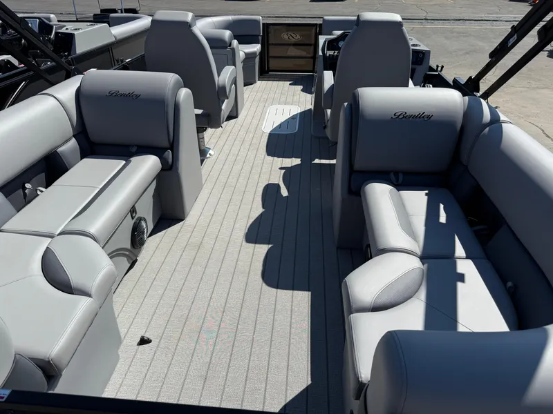 Slide: The Image of 2026 Bentley Pontoons Legacy 223 Navigator interior with gray seating and spacious layout. - 6