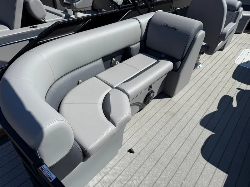 Slide: The Image of Luxurious seating on 2026 Bentley Pontoons Legacy 223 Navigator, featuring elegant gray upholstery. - 7