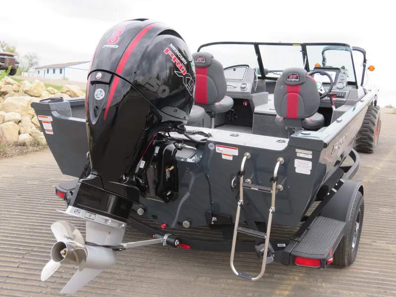 Slide: The Image of 2024 Ranger VS1782SC Angler boat with Mercury Pro XS engine, docked on a ramp. - 2