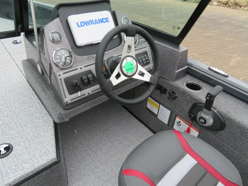 Slide: The Image of 2024 Ranger VS1782SC Angler boat dashboard with steering wheel and Lowrance display. - 7