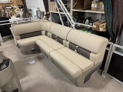 Slide: The Image of 2025 Sun Tracker Sportfish 24 XP3 boat seating in a warehouse setting. - 11