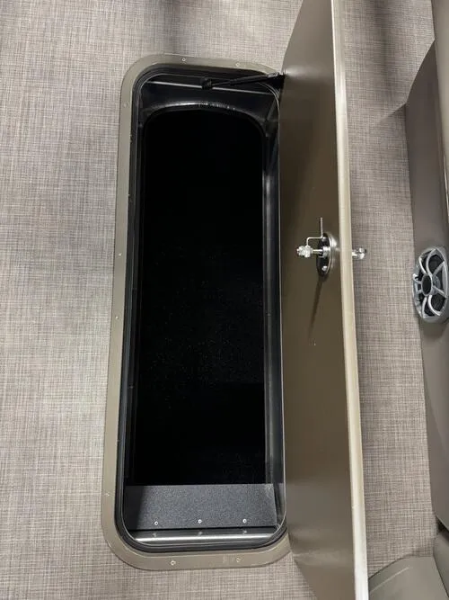 Slide: The Image of Open storage compartment on 2025 Sun Tracker Sportfish 24 XP3 boat. - 5