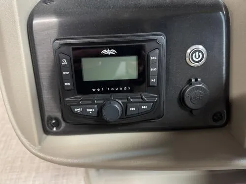 Slide: The Image of 2025 Sun Tracker Sportfish 24 XP3 audio control panel with Wet Sounds system. - 8