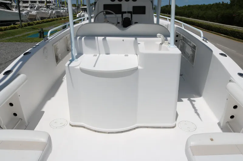 Slide: The Image of 2006 ProKat 2360 Center Console boat interior, featuring spacious seating and storage compartments. - 12